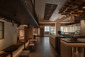 Inviting restaurant interior with a bar area, wine glasses, and comfortable seating