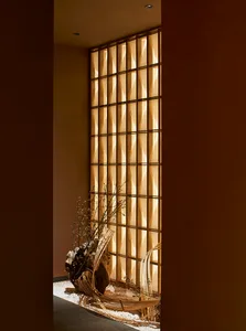 Cozy traditional room with wooden elements, dim lighting, and two vases on the floor