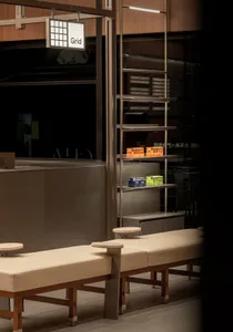 Dining area with multiple tables and chairs in a cozy restaurant or café, perfect for enjoying a meal or coffee