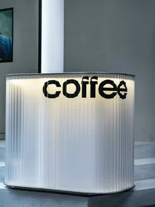 A modern coffee shop counter with a sleek stainless steel surface, showcasing the coffee shop's logo in a contemporary and inviting environment