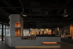 Inviting restaurant interior with a counter and seating area, featuring chairs and a dining table