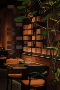 Warm and inviting dining space with brick walls, a wooden table, and a rustic atmosphere