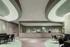 Modern restaurant interior with a counter area, chairs, and inviting atmosphere