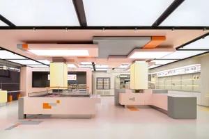 Bright and inviting restaurant interior with pink accents, modern design, and clean lines
