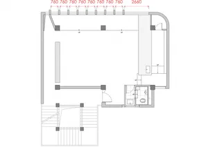 Empty minimalist room with white walls and floors, giving a clean and minimalist appearance