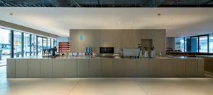 Industrial kitchen with wooden cabinets, appliances, and a focus on functionality and efficiency