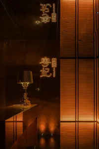 Dark room with a marble countertop, two lamps, and a cozy atmosphere