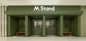 A secure entrance with two closed doors and green walls, suggesting a sense of organization and security within the building