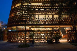 Modern restaurant with a unique triangular facade, featuring geometric patterns and a sophisticated atmosphere