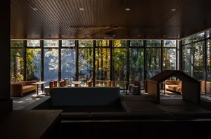 Bright and inviting cafe with large windows, comfortable seating, and a spacious dining area