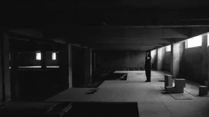 Empty modern lobby with a concrete ceiling, clean lines, and simple design elements