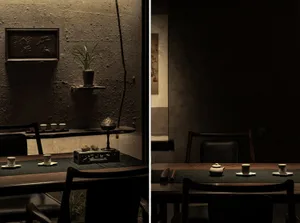 Dining area with chairs, tables, and a potted plant, set up for customers with cups and a comfortable atmosphere