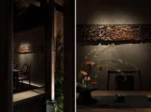 A modern living area with grey walls and a black chair, and a traditional bedroom with a wooden bed frame and a white chair, both featuring various pieces of furniture and potted plants