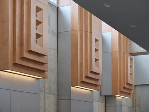 A warm and inviting lobby with wooden pillars, adding elegance and sophistication to the space