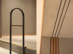 Two views of a modern interior space with stairs and a hallway, featuring wood elements and a warm atmosphere