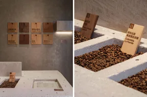 A coffee shop interior with a white display box and a container holding coffee beans, creating a cozy atmosphere