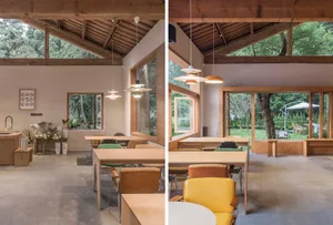 Warm and inviting space with wooden floors and walls, featuring chairs, tables, and potted plants, perfect for socializing and relaxation