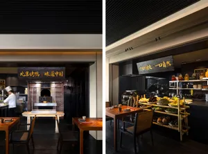 Warm and inviting restaurant interior with brick walls, a fireplace, and industrial kitchen with dining tables, chairs, and various tableware