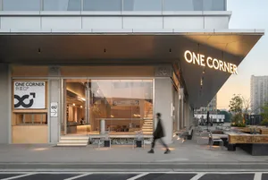 A restaurant with a large window, chairs, and a comfortable atmosphere