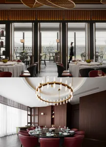 Sophisticated dining space with a large chandelier, multiple tables, chairs, and fine tableware