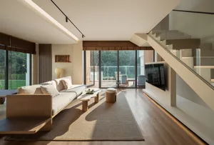 Open living area with hardwood floors, a flat screen TV, and a clean contemporary design