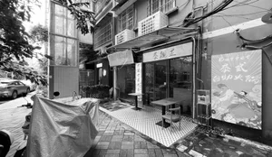 Cozy Asian restaurant with multiple dining tables and chairs, inviting atmosphere, and comfortable seating options