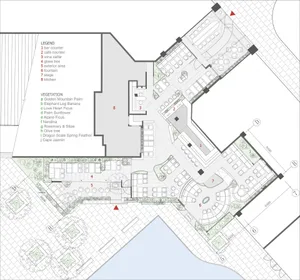 2D floor plan of an office space with multiple seating areas, chairs, dining tables, and potted plants, showcasing organization and functionality