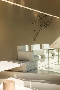 A modern and minimalist interior design concept featuring multiple chairs in a clean and organized space with bright and inviting lighting