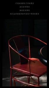 A modern dining space with a metal chair in front of a black table, set in a stylish and contemporary atmosphere