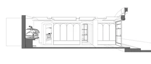 Empty minimalist building with large windows, archways, and a concrete exterior