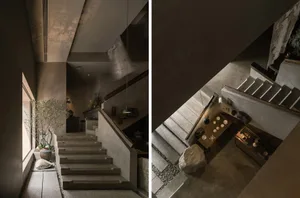 A staircase made of wood in a cozy living space with a warm and inviting atmosphere, connecting to a basement area