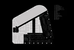 Black and white architectural rendering of a modern building interior with a mix of open areas and smaller rooms, showcasing a complex layout