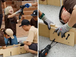 Workers in a construction setting, using tools and collaborating on a project