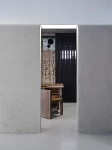 Cozy kitchen dining space with a brick design, a dining table, chairs, and a sink, perfect for gatherings and meals