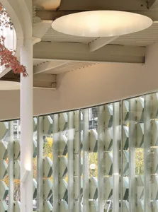 A modern interior space with white walls, clean lines, and minimalistic elements, featuring multiple rooms and windows