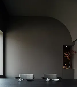 Empty dining area with two chairs and a small table in a calm and inviting atmosphere