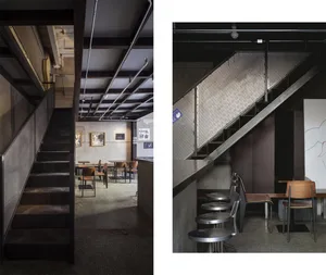 Modern restaurant interior with stairs, chairs, dining tables, and a couch in a bright and inviting atmosphere