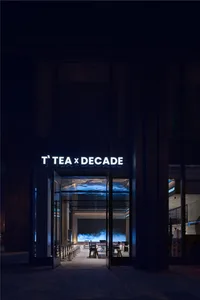 Sophisticated restaurant interior with black and white elements, comfortable seating areas, and elegant ambiance