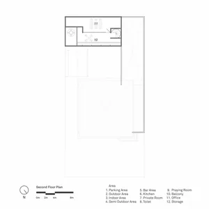 Black and white top-down view of a minimalist second floor plan with a kitchen, bathroom, and living area, featuring two balconies
