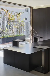 A cozy dining space with a metal table and chairs, surrounded by inviting atmosphere and comfortable seating