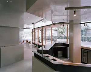 Modern restaurant interior with a large bar area, fireplace, and comfortable seating for guests