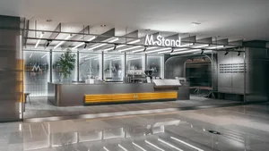 A modern dining space with a counter and various items on display, featuring potted plants and a stylish atmosphere