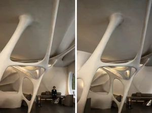 A modern lobby with a large white concrete structure, chairs, a dining table, and a couch, creating a comfortable and inviting atmosphere for social interaction and relaxation