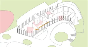 A spacious interior space with white walls, columns, and a fence, featuring a clean and bright atmosphere