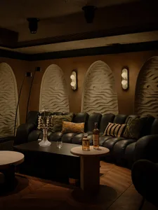 Cozy living space with a couch, chairs, dining table, and decorative elements