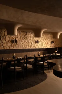 An inviting restaurant with various tables and chairs, providing ample space for guests to dine