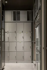 A large storage area filled with metal cabinets arranged in rows, creating an organized and efficient storage solution
