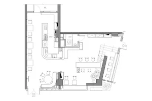 A modern open-plan living and dining area with multiple chairs, tables, couches, and ample seating options