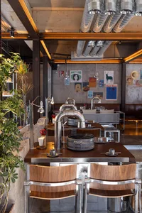 Warm and inviting restaurant interior with wooden tables and chairs, cozy lighting, and comfortable seating