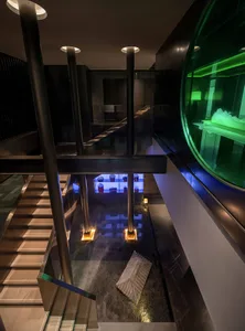 Underground space with concrete walls, spiral staircases, and industrial feel